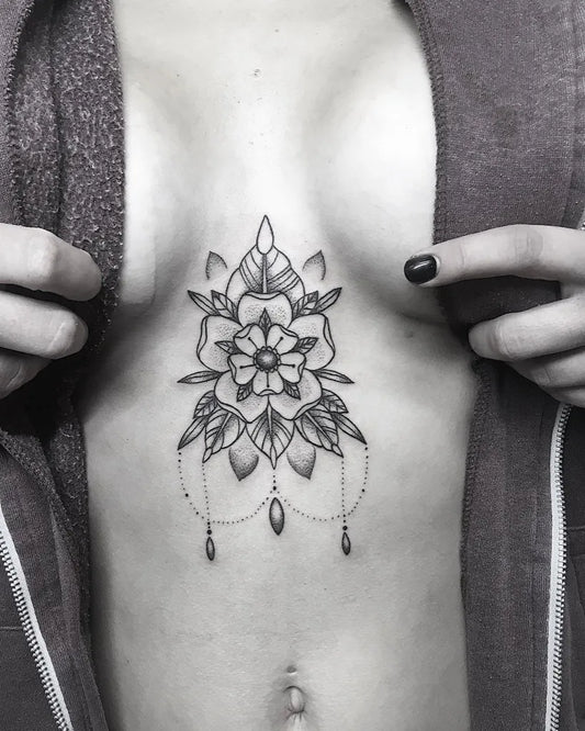 Small Mandala Flower with Drapes on Women Sternum Tattoo by @a.fineline.tattoo