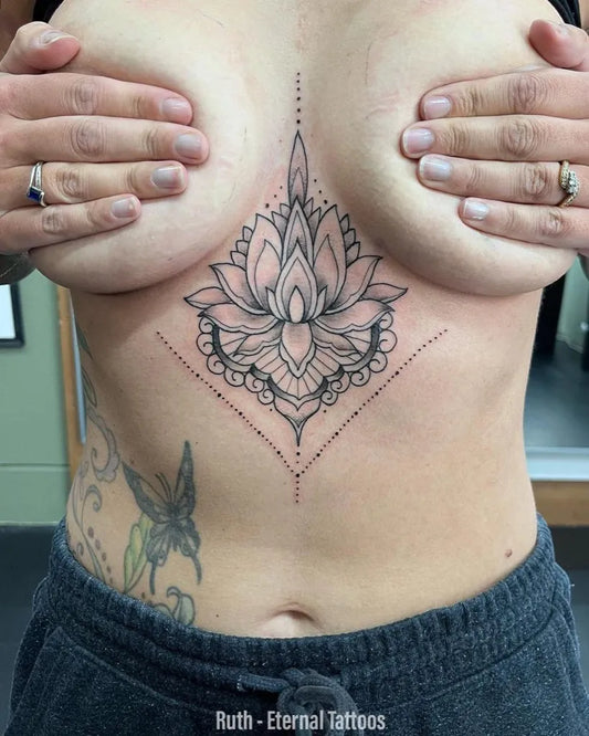 Small Mandala Lotus on Women Sternum Tattoo by @eternaltattoos