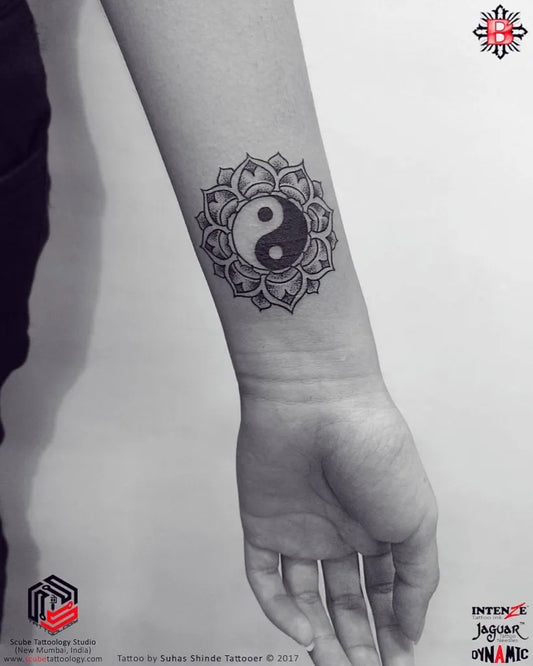 Small Mandala Yin Yang Tattoo on Women Arm by @tattoology_studio