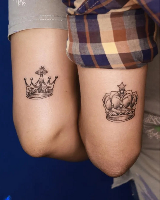 Small Matching Crown Tattoo on Couple Elbow by @blue_heaven_tattooz