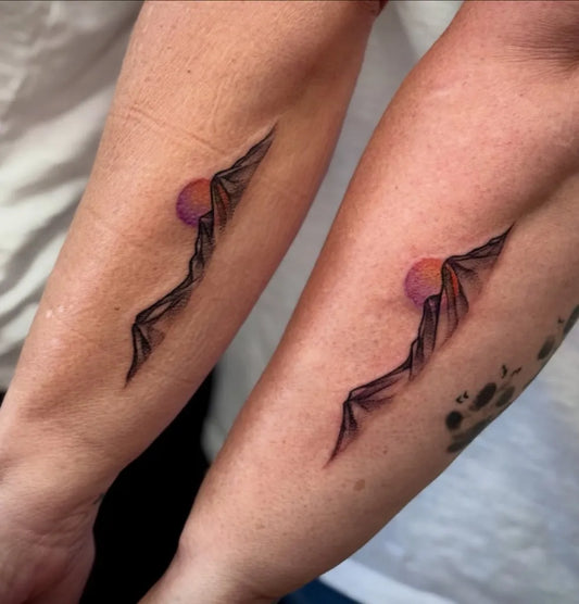 Small Matching Fuji Mountain Sun Tattoo on Women Arm by @kelmonsterrr