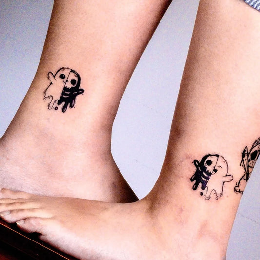 Small Matching Ghost Tattoo on Women Ankle by @inkkoela