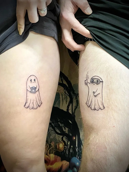 Small Matching Ghost and Smoking Ghost Tattoo on Women Thigh by @alora.ink