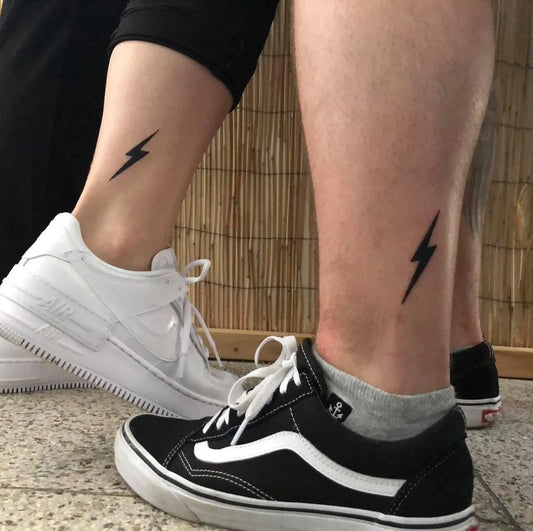Small Matching Lightning Tattoo on Women Ankle by @pablo86_ink