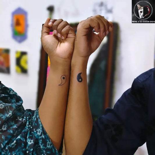 Small Matching Minimalist Yin Yang Tattoo on Women Wrist by @mog_tattoos_goa