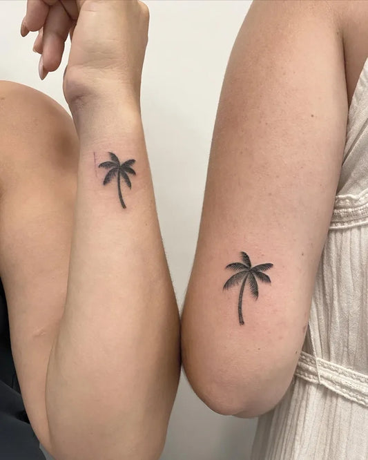 Small Matching Palm Tree Tattoo on Women Arm by @goodluck.tattoopalma