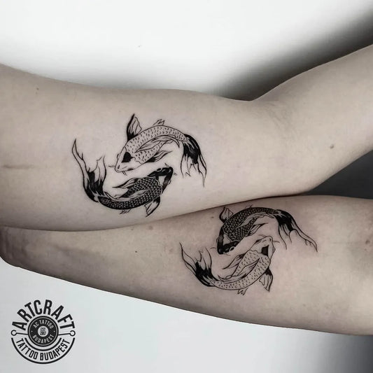 Small Matching Yin Yang Koi Fish Tattoo on Women Arm by @artcraft_tattoo