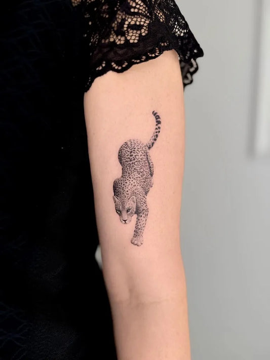 Small Micro Realism Cheetah on Women Arm Tattoo by @perrevoort_tattoo