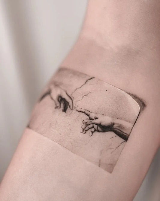 Small Micro Realism Creation of Adam on Women Arm Tattoo by @hood.seven.guests