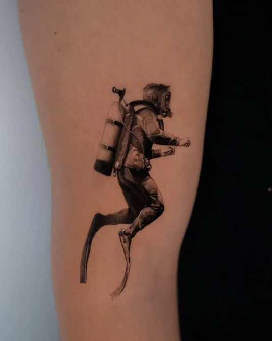 Small Micro Realism Diver with Tank and Fins on Men Arm Tattoo by @_francesco.fortini