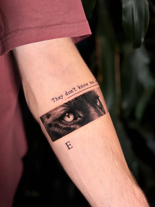 Small Micro Realism Eyes Text on Men Arm Tattoo by @wilcza.tattoo