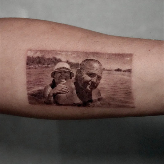 Small Micro Realism Family Beach Photo on Men Arm Tattoo by @shinnyeong_tattoo