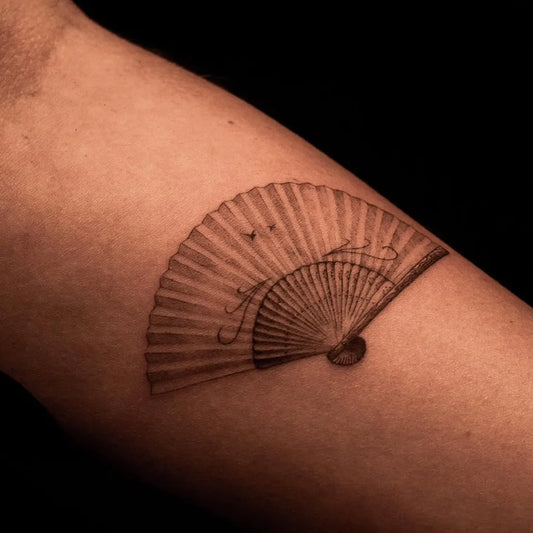 Small Micro Realism Folded Fan on Men Arm Tattoo by @azala.studio