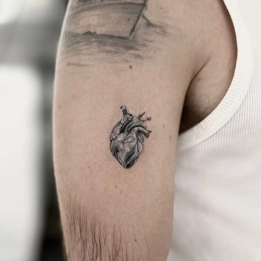 Small Micro Realism Heart on Men Arm Tattoo by @inkbyemre