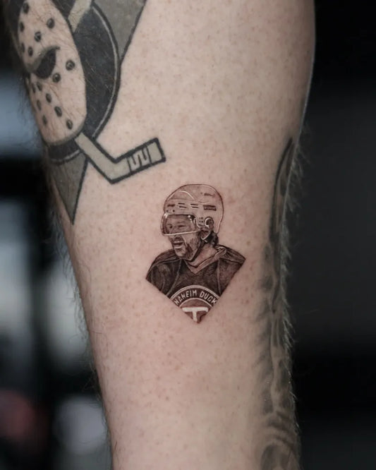 Small Micro Realism Hockey Player on Men Arm Tattoo by @gubanov_tattoo