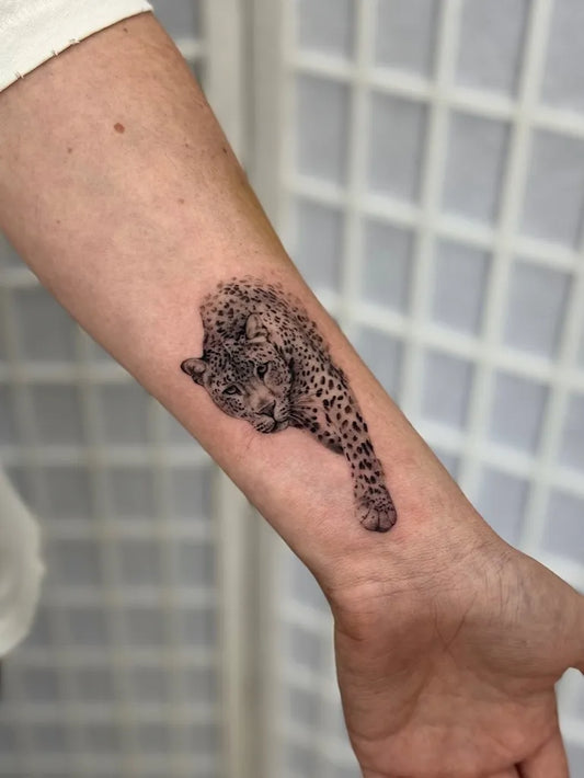 Small Micro Realism Leopard on Women Arm Tattoo by @laurensmithtattoos