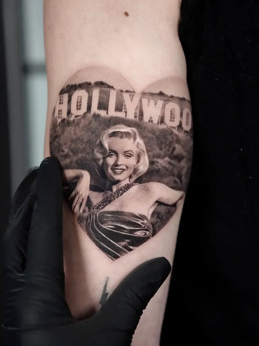 Small Micro Realism Marilyn Monroe Hollywood Sign Heart on Women Arm Tattoo by @goldy_z