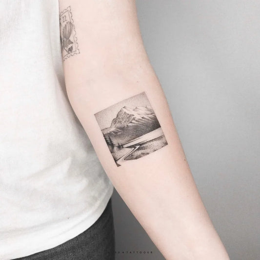 Small Micro Realism Mountain Tattoo on Women Arm by @klax.tattooer