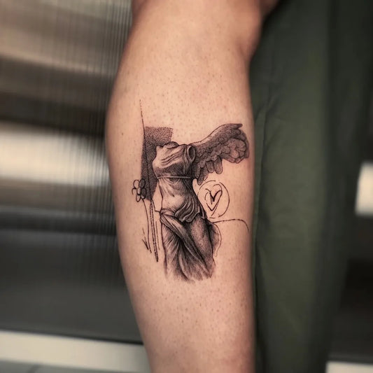 Small Micro Realism Nike with Heart on Women Leg Tattoo by @lucathelightneedle