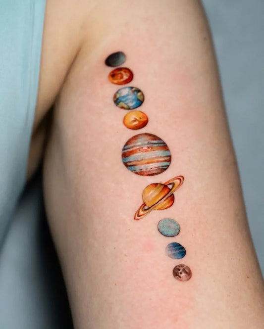 Small Micro Realism Planets on Women Arm Tattoo by @adriannalcazar
