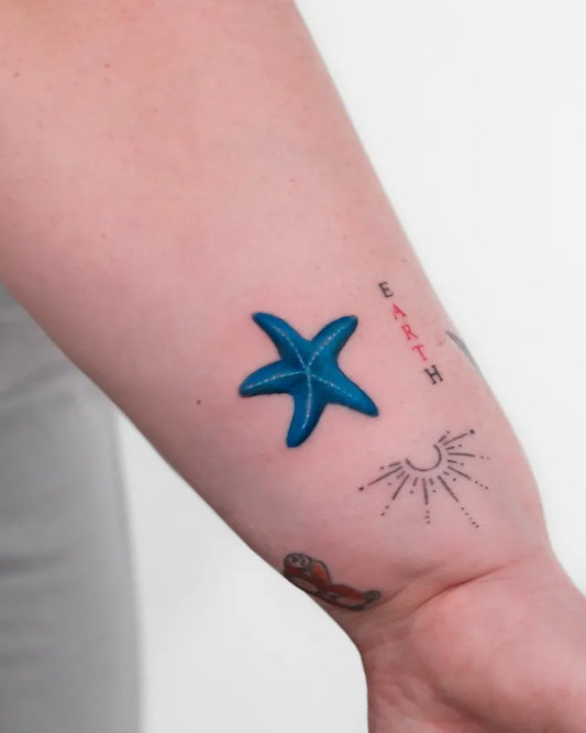 Small Micro Realism Starfish Earth Sun on Women Arm Tattoo by @tugbakizilkan