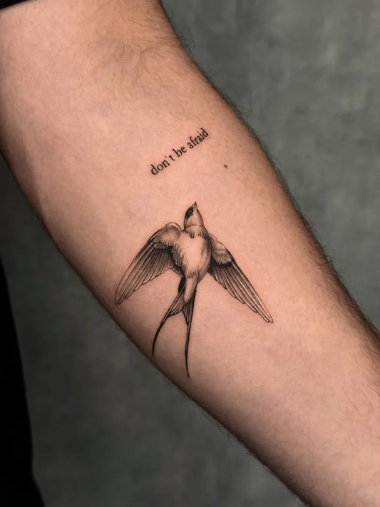 Small Micro Realism Swallow and Text on Men Arm Tattoo by @hanieh.tattoos