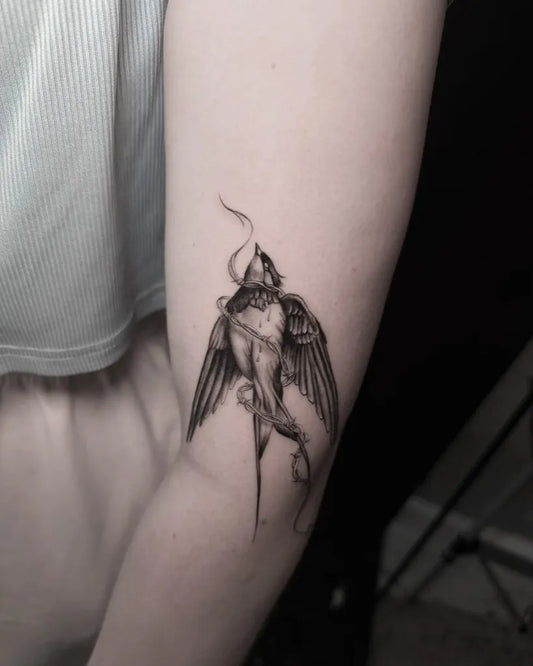 Small Micro Realism Swallow with Smoke and Flowers on Women Arm Tattoo by @czaras_tattoo