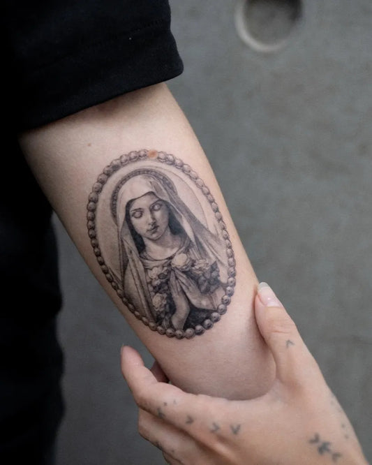 Small Micro Realism Virgin Mary in Oval Frame on Women Arm Tattoo by @adussynk