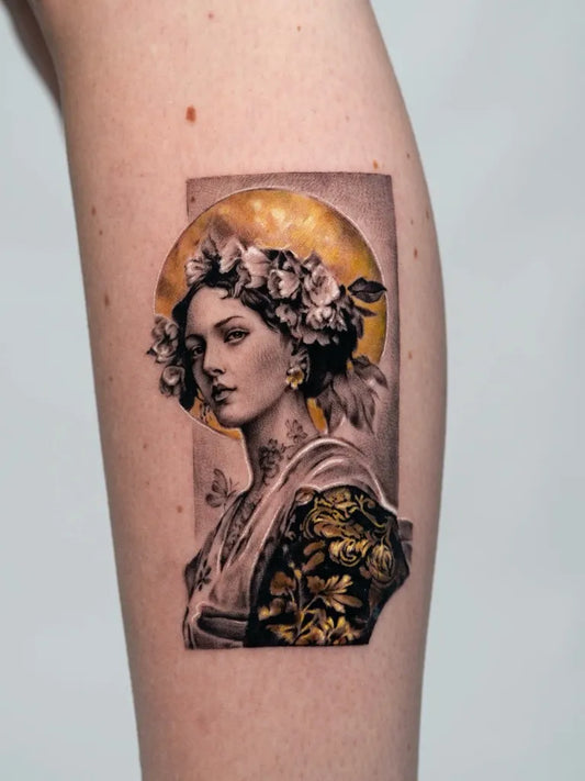 Small Micro Realism Woman with Floral Crown and Gold Halo on Women Arm Tattoo by @nadiamost