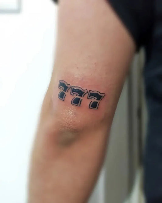 Small Minimalist 777 Tattoo on Men Arm by @artiso_._
