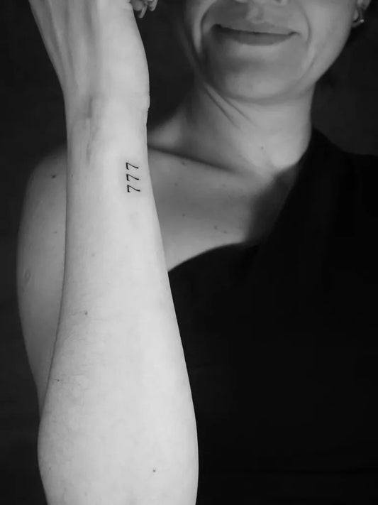 Small Minimalist 777 Tattoo on Women Wrist by @makalaink