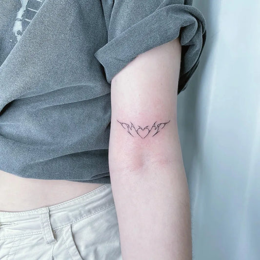 Small Minimalist Abstract Heart Flames on Women Arm Tattoo by @the.pinktattoo
