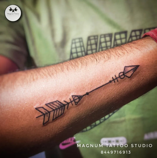 Small Minimalist Arrow Tattoo on Men Arm by @magnumtattooindia