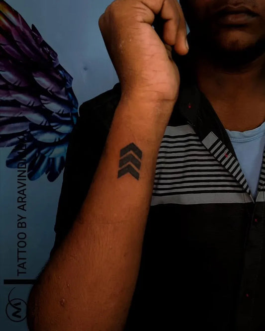 Small Minimalist Arrow Tattoo on Men Wrist by @mei_tattoos_studio