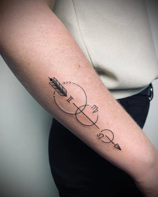 Small Minimalist Astrology Arrow Tattoo on Women Arm by @luzanneink