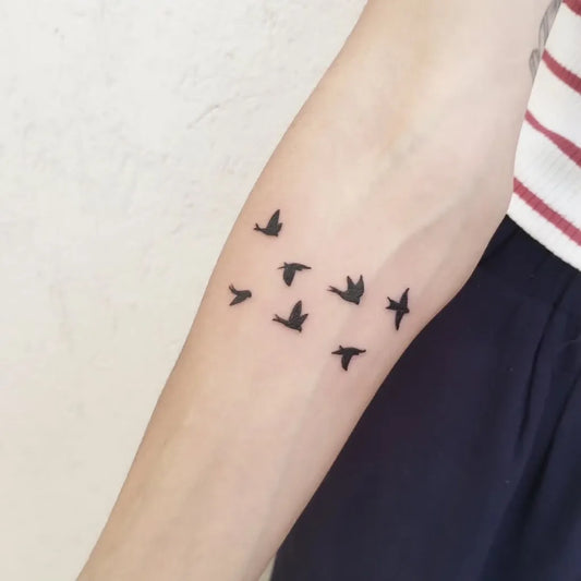 Small Minimalist Birds Tattoo on Women Arm by @alu.tattoo