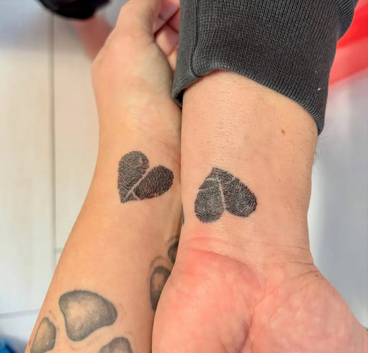 Small Minimalist Broken Heart on Women Wrists Tattoo by @claudia86_ink