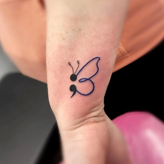 Small Minimalist Butterfly Semicolon on Women Wrist Tattoo by @stacey_angus_ink