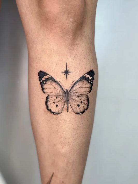 Small Minimalist Butterfly Star on Women Knee Tattoo by @camillajax.tattoo