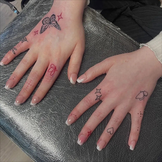Small Minimalist Butterfly Stars Hearts on Women Fingers Tattoo by @faern_tattoos