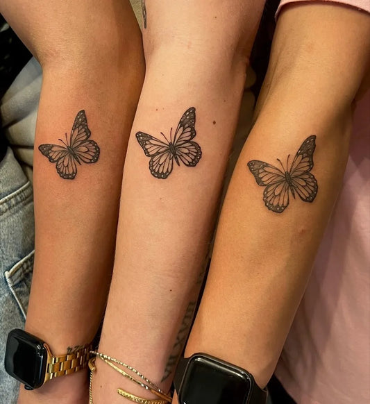 Small Minimalist Butterfly on Friends Arm Matching Tattoo by @king.ink