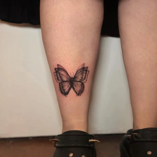 Small Minimalist Butterfly on Women Ankle Tattoo by @liz.tattooz