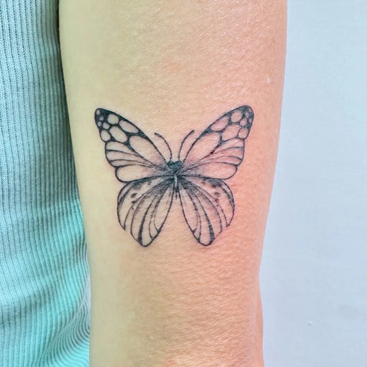 Small Minimalist Butterfly on Women Forearm Tattoo by @catalysttattoosg