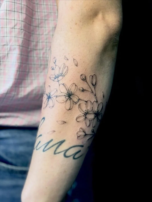 Small Minimalist Cherry Blossom Branch with Luna Text on Women Arm Flower Tattoo by @mary_in_jane