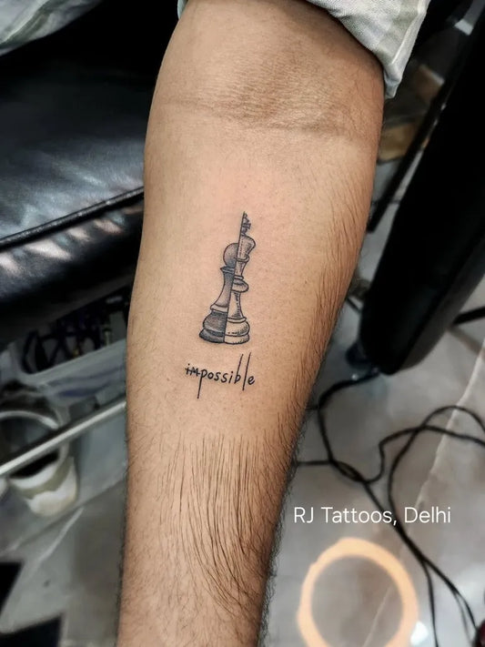Small Minimalist Chess King Impossible on Men Forearm Tattoo by @rjtattoos