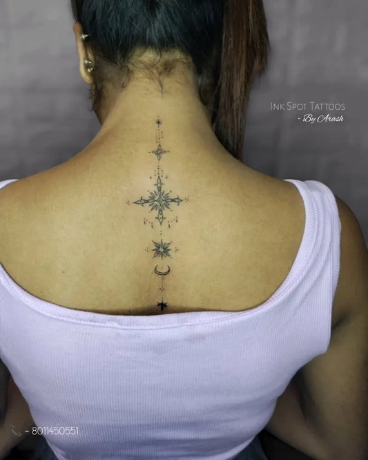 Small Minimalist Compass Stars Moon on Women Spine Tattoo by @the_ink_spot_tattoos