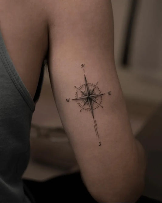 Small Minimalist Compass on Women Upper Arm Tattoo by @chingyuuki