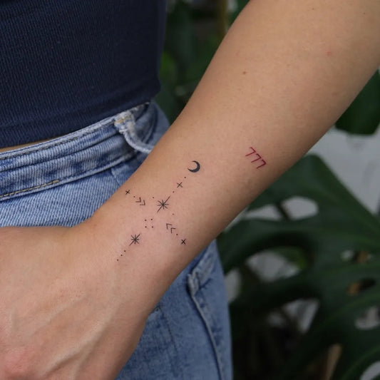 Small Minimalist Crescent Moon Constellation 777 Tattoo on Women Wrist by @gokce.karahasan