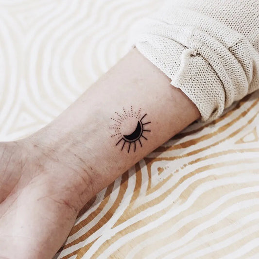 Small Minimalist Crescent Moon Sun Tattoo on Women Wrist by @kalula_tattoo