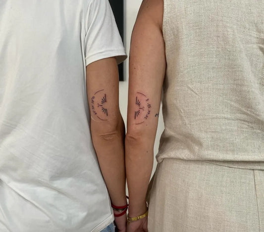 Small Minimalist Crescent Moon Wings on Couple Arms Matching Tattoo by @charming_tattoo_heraklion
